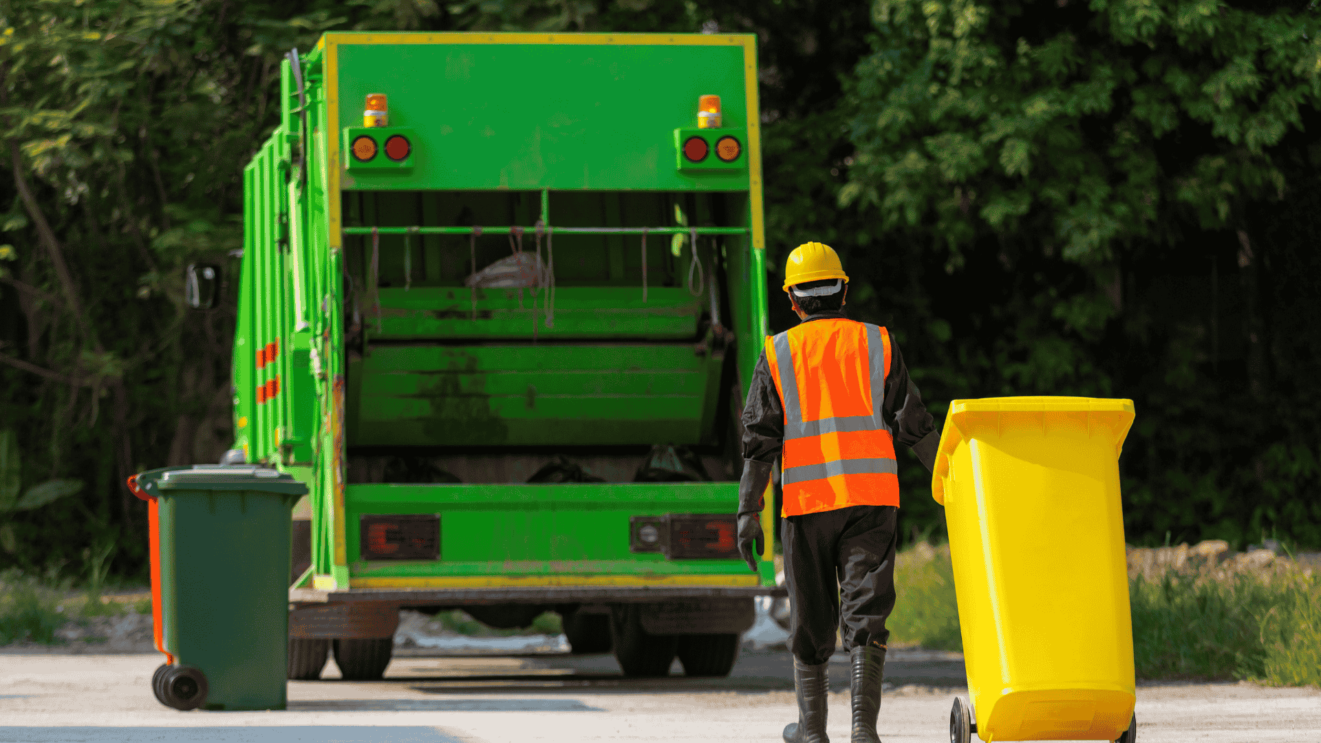 worker loading trash bins during residential cleanout service Dallas Fort Worth