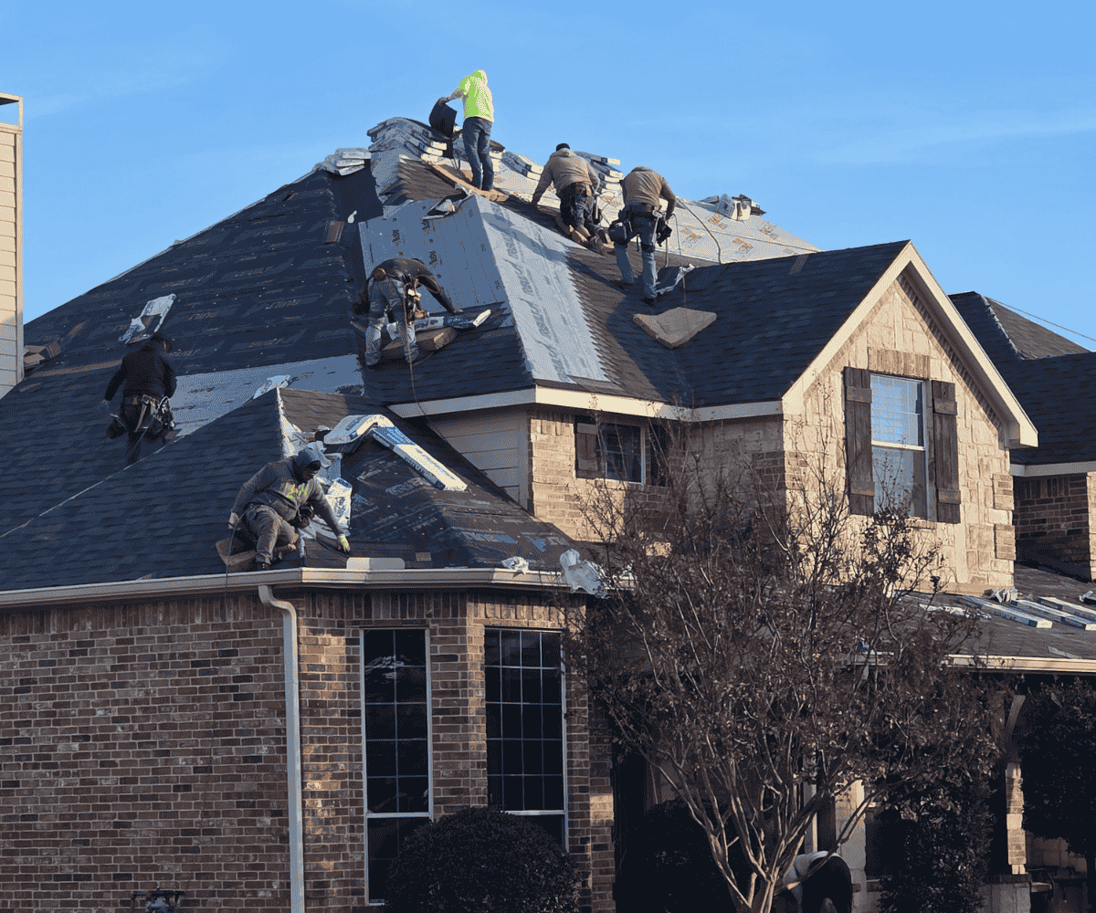 roofing crew installing shingles on residential home Dallas Fort Worth