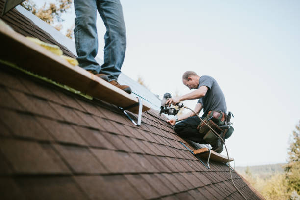 Roofing crew reviewing repair plan beside a McKinney home before work begins