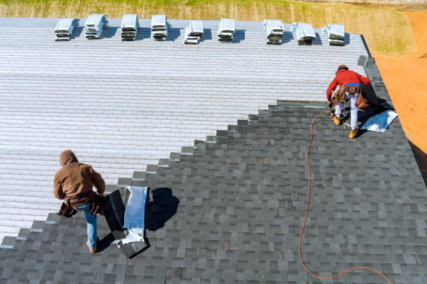 Roofing specialist inspecting flashing and shingle wear with ladder and diagnostic tools, Skilled roofer examining roof flashing, shingles, and ventilation during a professional inspection, Roofing professional reviewing flashing, vents, and shingle wear on steep roof