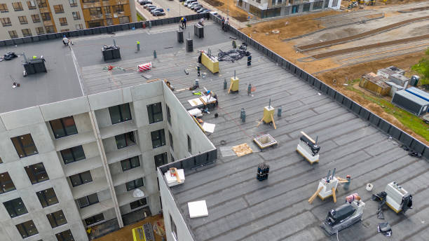 Roofers replacing worn shingles on Mesquite residential roof during planned daytime repair