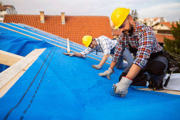 Experienced roofer examining flashing details and moisture-prone roof sections with inspection tools