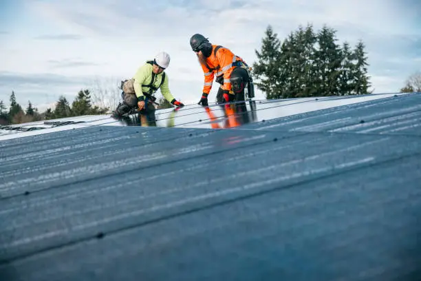 Roofing crew inspecting shingle and flashing damage on occupied suburban home, Roofing crew inspecting flashing and shingle wear on an Allen residential roof, Roofing crew repairing damaged shingles on Fort Worth home after strong seasonal storm