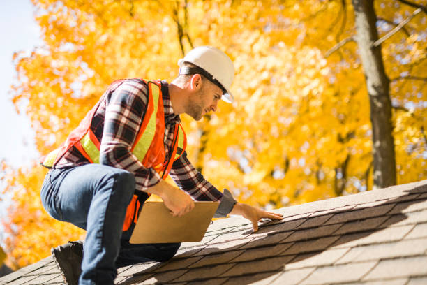 Experienced roofer inspecting flashing, valleys, and ventilation on sloped roof, Professional roofer inspecting flashing, shingles, and roof ventilation for long-term performance, Experienced roofer examining roof valley and flashing for hidden weather-related damage