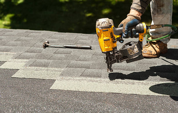 Roofing crew inspecting worn shingles on Grand Prairie residential roof, Roofing crew inspecting shingle wear and flashing on a McKinney residential property