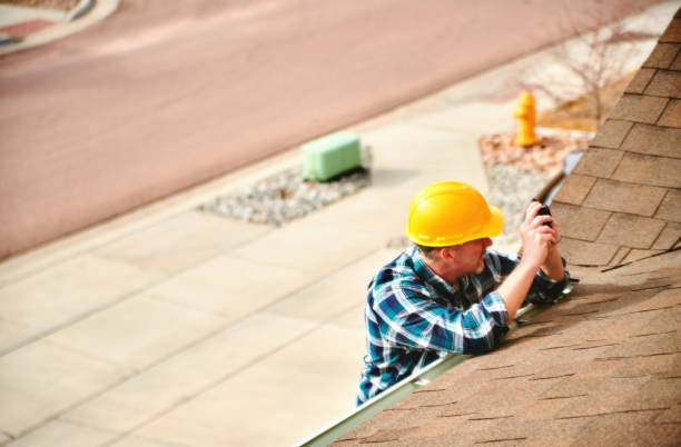 Skilled roofer examining flashing and roof penetrations with inspection tools, Experienced roofer checking roof condition, ventilation, and flashing with professional inspection tools