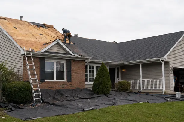 Crew performing roof replacement on a weathered Anna - TX home while inspecting decking and flashing