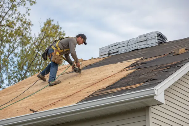 Roof replacement crew in McKinney - TX checking flashing lines and decking before installing new shingles
