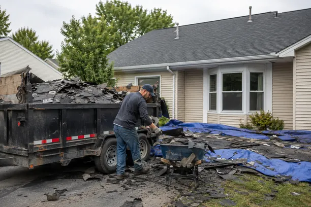 Roof Replacement in Murphy - TX underway as a crew installs new shingles on a suburban home